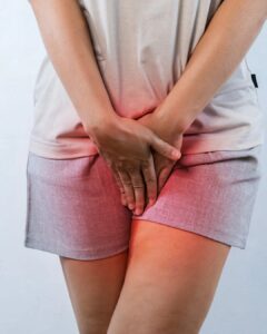 Woman experiencing pelvic floor discomfort and bladder urgency common symptoms treated with pelvic floor therapy in Barrie